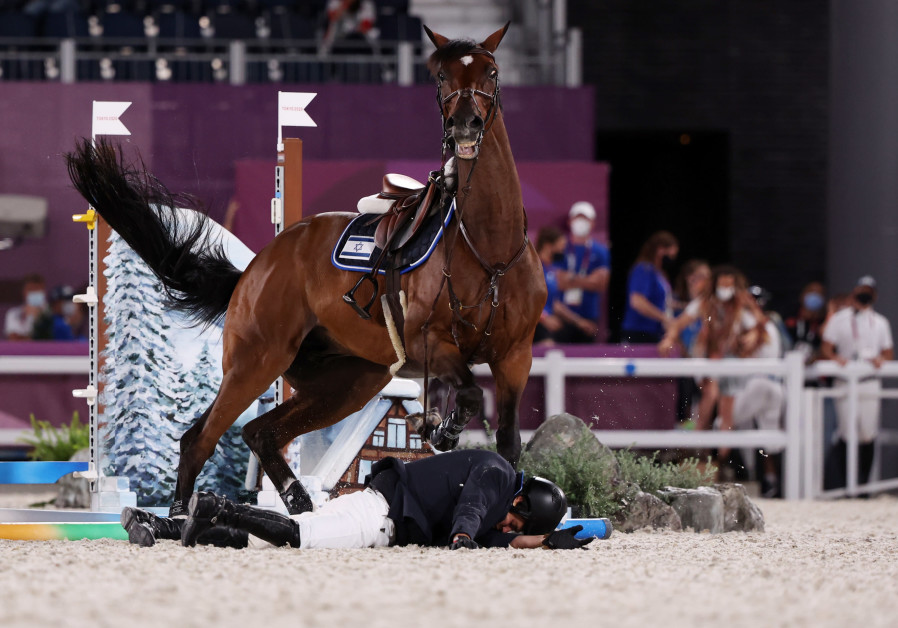 Teddy Vlock of Israel fell off his horse Amsterdam 27 during the jumping team qualifications, August 6, 2021. (Credit: REUTERS/ALKIS KONSTANTINIDIS)