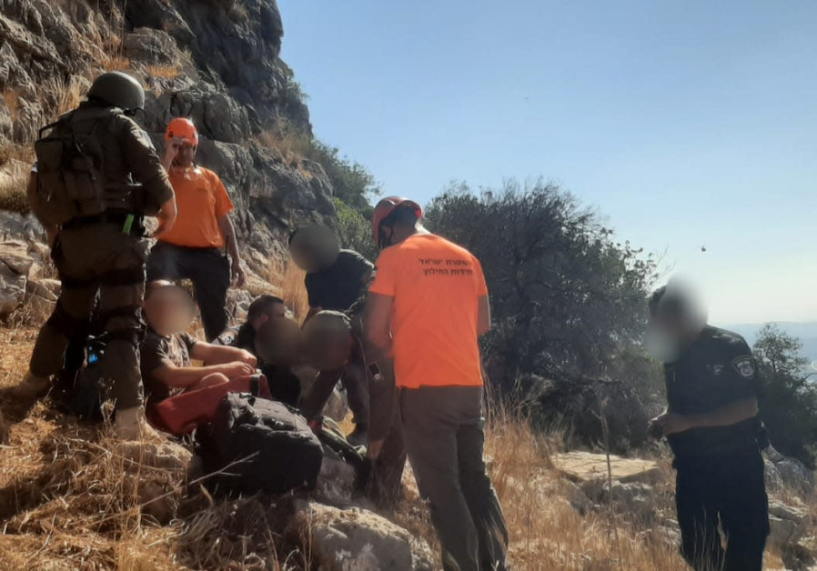 Galil-Carmel search-and-rescue volunteers treat a 14-year-old boy who fell off a cliff in the upper Galilee, August 14th 2021 (Credit: GALILEE-CARMEL SEARCH AND RESCUE TEAM SPOKESPERSON