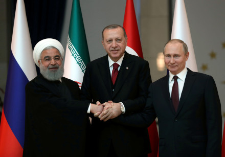 Presidents Hassan Rouhani of Iran, Tayyip Erdogan of Turkey and Vladimir Putin of Russia pose before