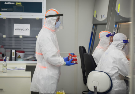 Israeli army Technicians carry out a diagnostic test for coronavirus in a IDF lab in central Israel on July 15, 2020.