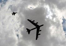 A U.S. B52 plane (R) flies during Exercise Eager Lion at one of the Jordanian military bases in Zarqa, east of Amman, Jordan, May 24, 2016. 