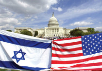 AMERICAN AND ISRAELI flags fly during a demonstration in support of Israel at the US Capitol in 2002