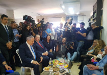 Prime Minister Benjamin Netanyhu (L) visits the shiva house of Rabbi Ahiad Ettinger