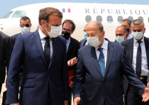 Lebanon's President Michel Aoun welcomes French President Emmanuel Macron upon his arrival at the airport in Beirut, Lebanon August 6, 2020