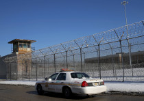 A Cook County Sheriff's police car patrols the exterior of the Cook County Jail in Chicago, Illinois