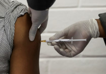 A volunteer receives an injection in a human clinical trial for a potential vaccine against the novel coronavirus, at the Baragwanath hospital in Soweto, South Africa, June 24, 2020