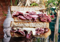 The Reubecca is a pork-heavy take on a Reuben sandwich. 