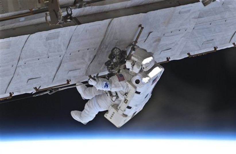 EVA on ISS (photo credit: AP)