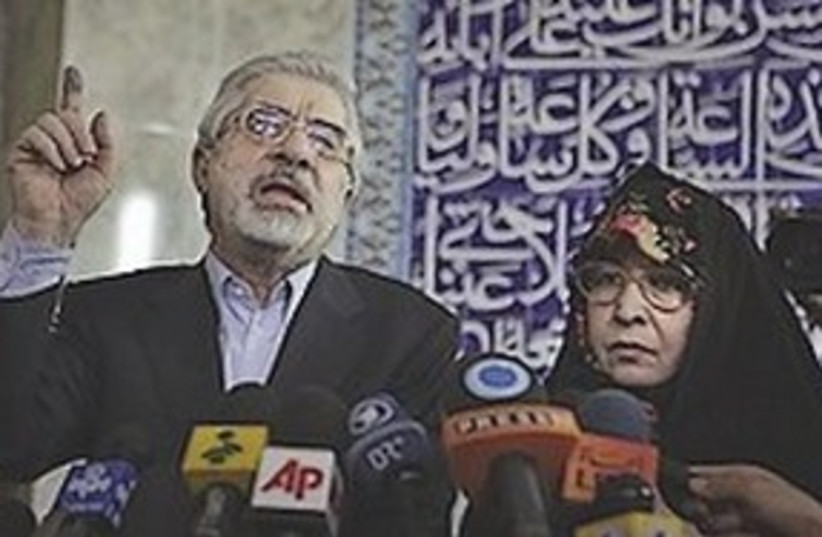 311_mousavi with mikes (photo credit: ASSOCIATED PRESS)