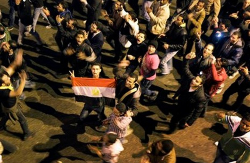 Anti-government protesters walk in Cairo