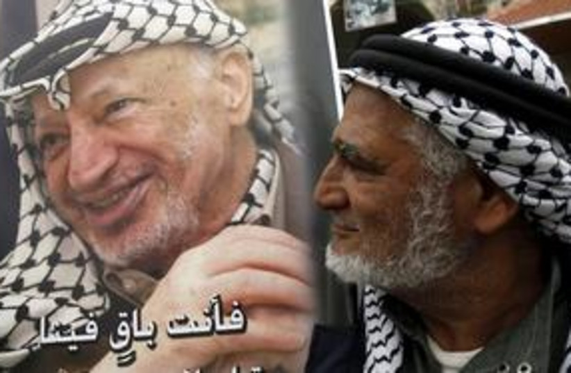 Fatah supporter holds Arafat poster
