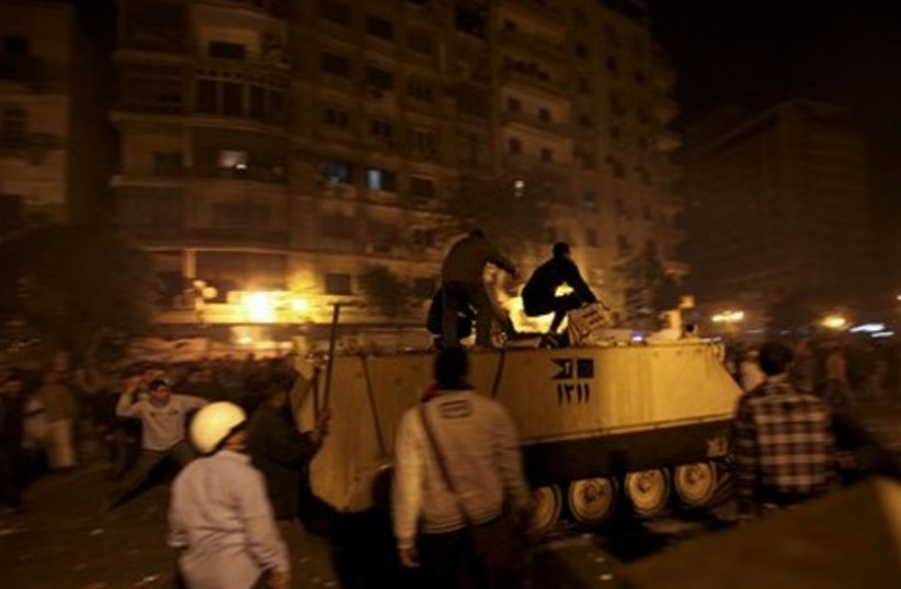 Egypt protesters on a military APC