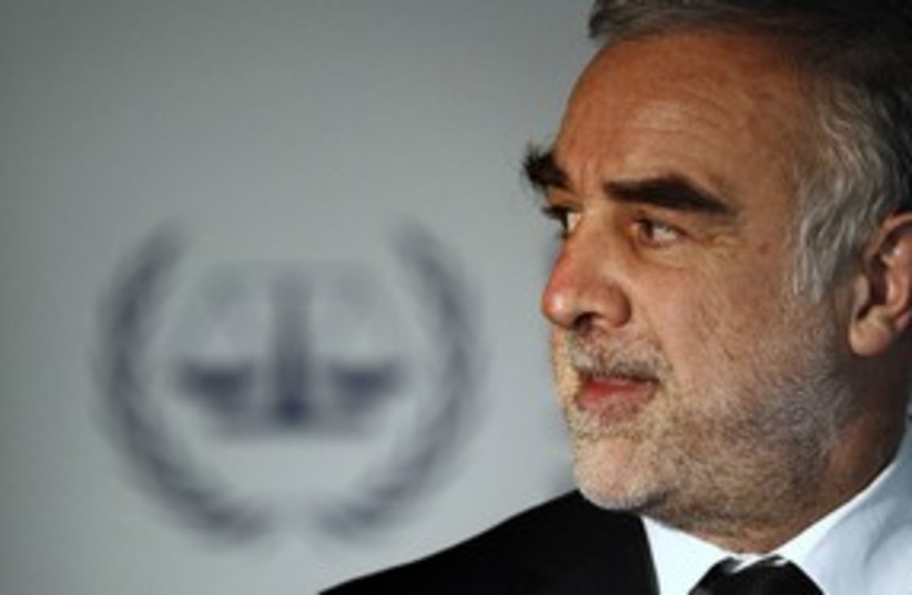Former ICC chief Luis Moreno-Ocampo (R) 311 (photo credit: Jerry Lampen / Reuters)
