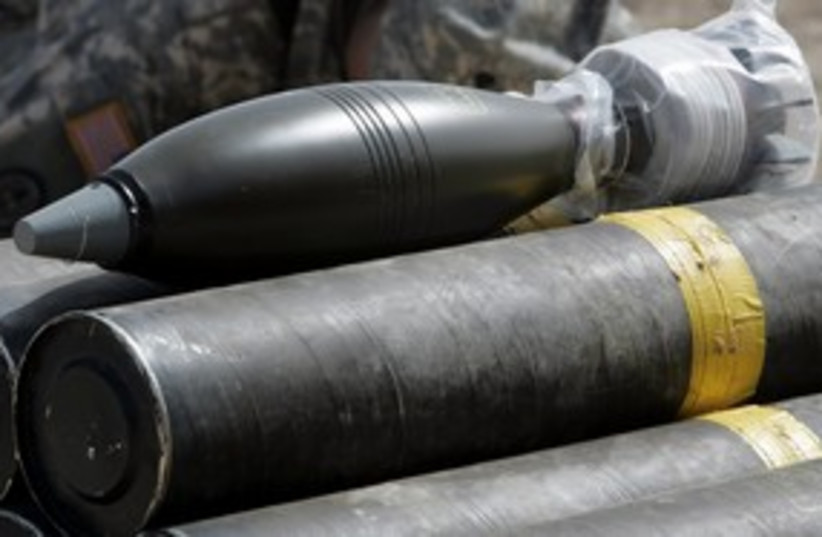 Mortar rockets on display (R) 311 (photo credit: REUTERS/Ali Jasim)