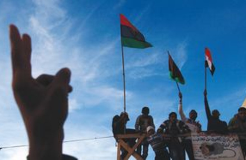 Libya peace victory sign 311 (R) (photo credit: REUTERS)