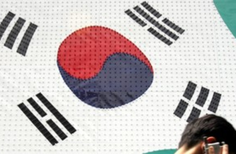 south korean flag_311 reuters (photo credit: Reuters / Lee Jae Won)