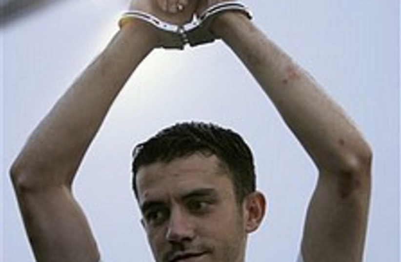 prisoner hands up 224.88 (photo credit: AP)
