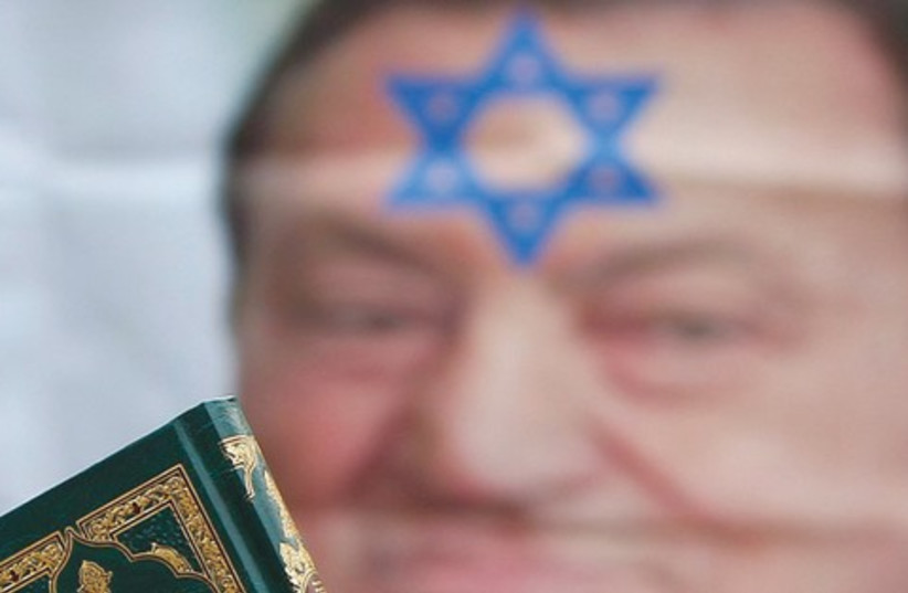 Koran and Mubarak Jew_311 (photo credit: Reuters)