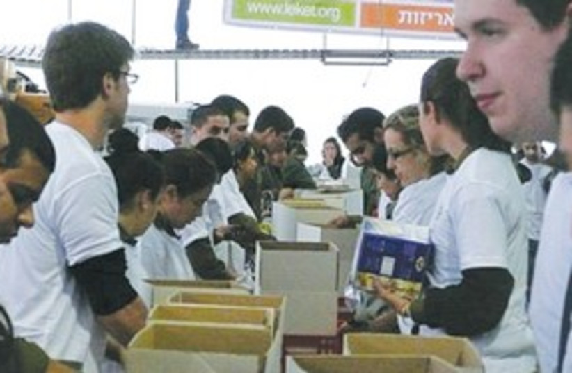 FILLING BOXES with basic food staples for the needy 311 (photo credit: Ruth Eglash)