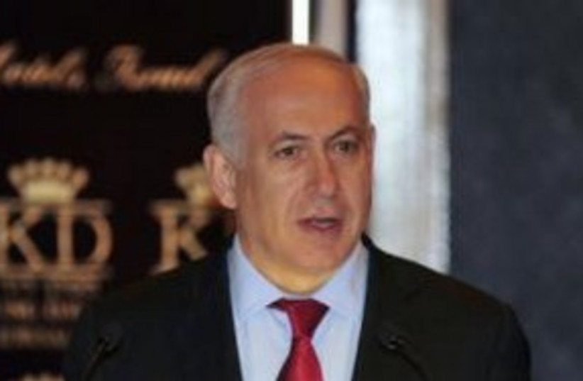 Prime Minister Binyamin Netanyahu open mouth 311 (R) (photo credit: REUTERS/Yin Dongxun)