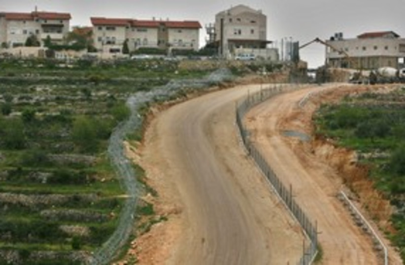West Bank security fence barrier wall settlement 311 (R) (photo credit: Reuters)