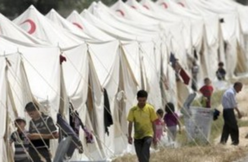 Syrian refugees in Turkish camp 311 (R) (photo credit: REUTERS/Osman Orsal)