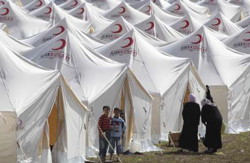 Syrian refugee camp 521 (photo credit: REUTERS/Osman Orsal)