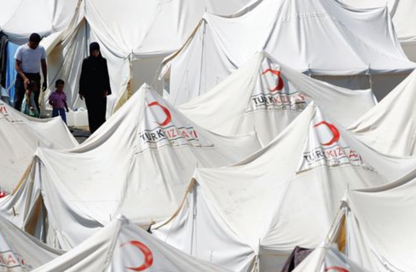 Syrian at Turkish refugee camp 520 (photo credit: REUTERS)