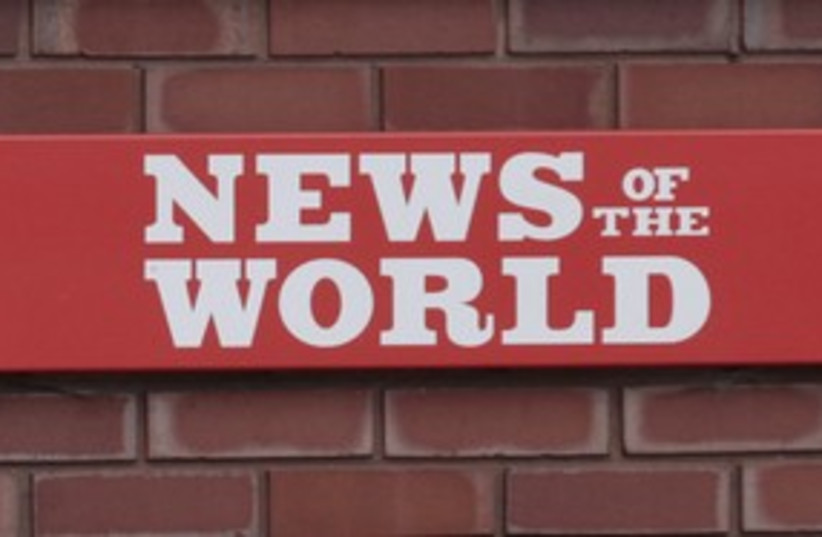 'News of the World' sign 311 (R) (photo credit: Olivia Harris / Reuters)