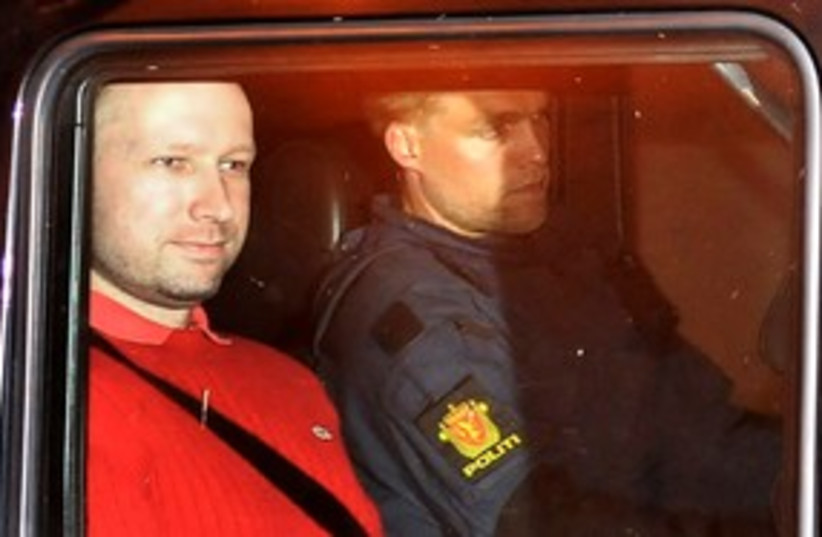 Norwegian terror suspect Breivik leaves court 311 (R) (photo credit: REUTERS/Jon-Are Berg-Jacobsen/Aftenposten via Scan)