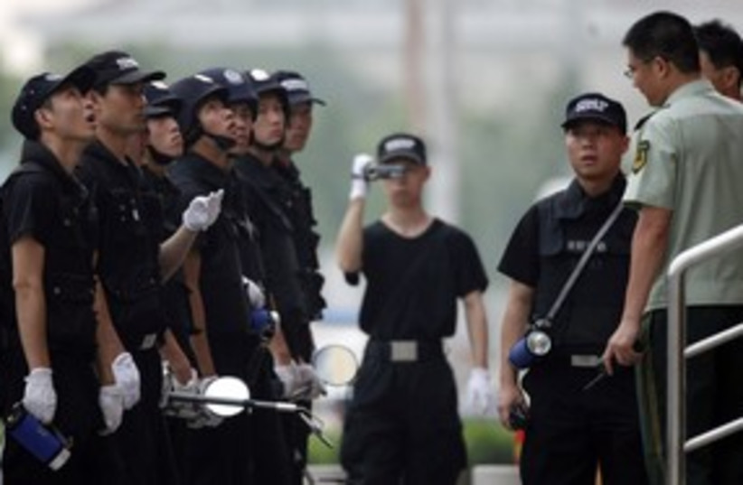 chinese police generic 311 R (photo credit: REUTERS/Carlos Barria)