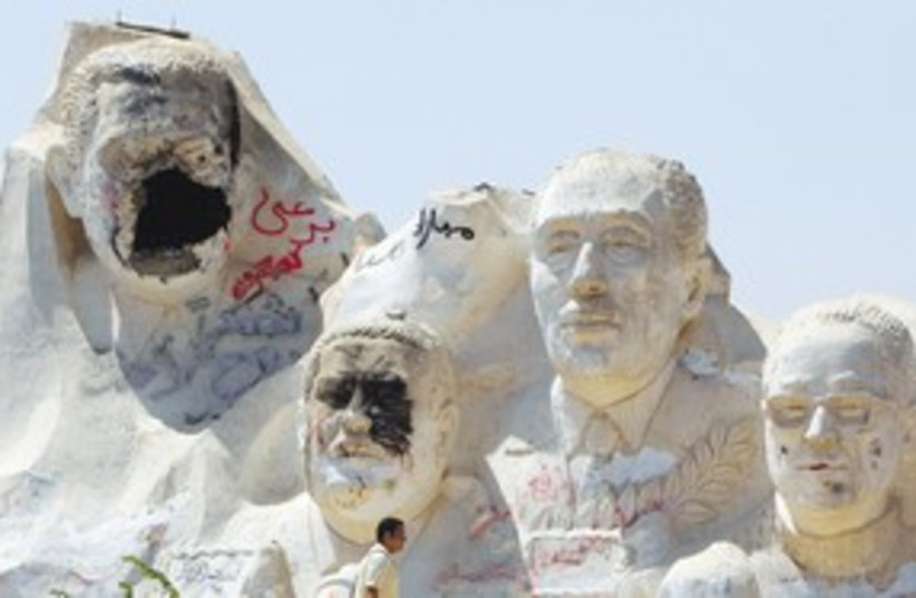 Defaced Mubarak statue, Egypt_311 (photo credit: Reuters)