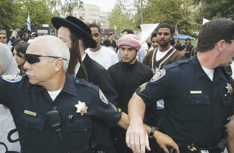 Police keep an eye on Jewish and Muslim students. (photo credit: Los Angeles Times/MCT)