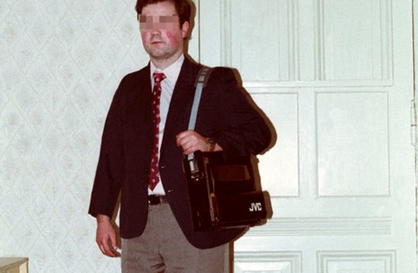 Stasi agent  presenting a disguise outfit