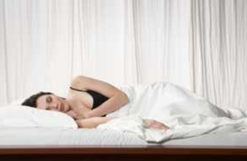 Woman sleeping bed insomnia 311 (photo credit: Thinkstock/Imagebank)