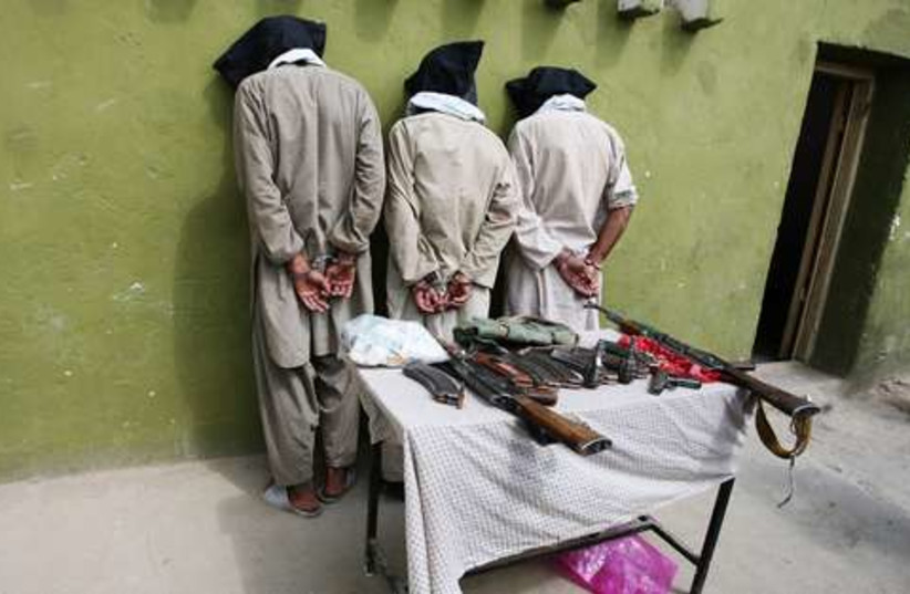 captured Taliban 521 (photo credit: REUTERS/Mustafa Andalib)