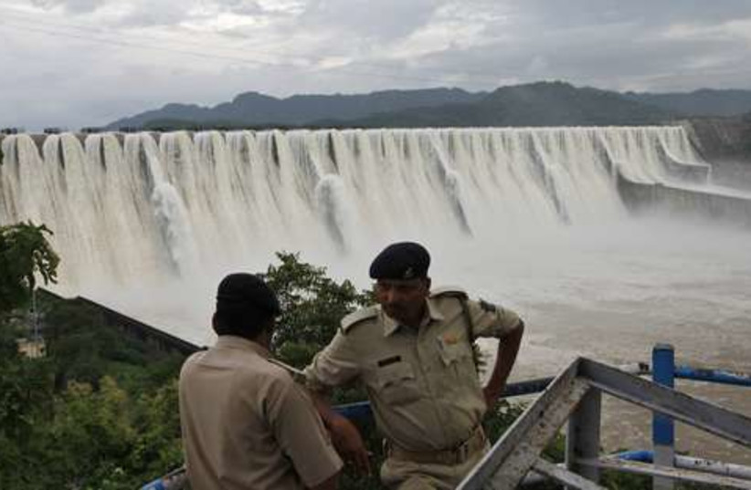 overflowing dam in India  521 (photo credit: REUTERS/Amit Dave)