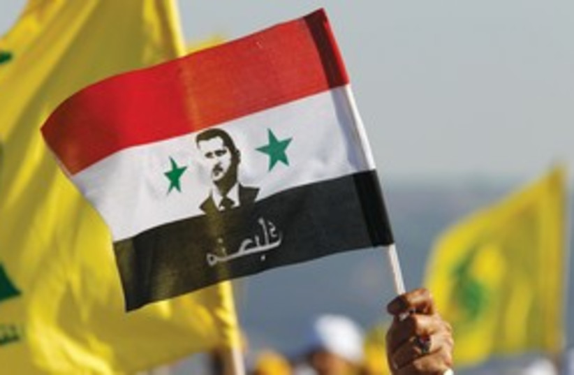 Bashar Assad flag (photo credit: Reuters)