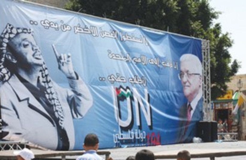 A SIGN displaying the images of Yasser Arafat, Abbas (photo credit: Ben Hartman)