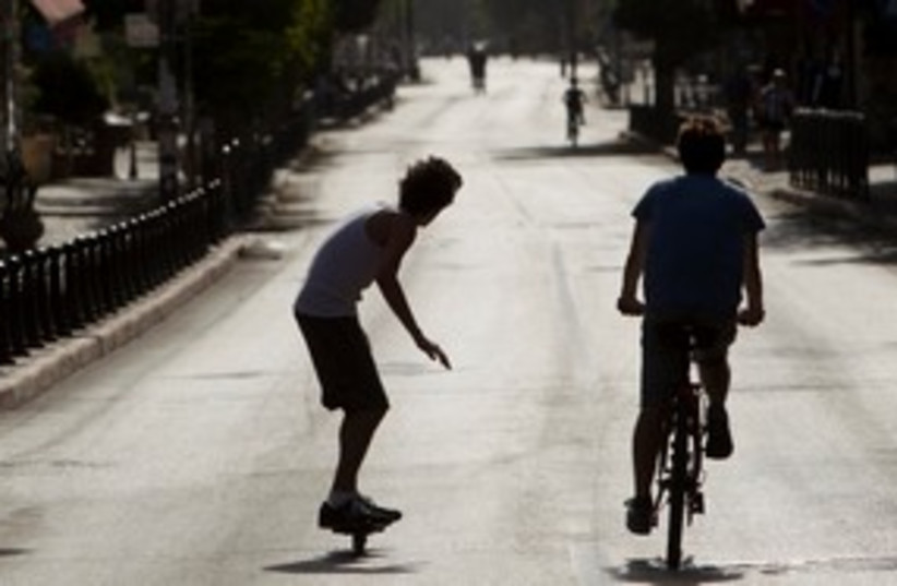 Kids on bikes on Yom Kippur 311 (photo credit: REUTERS/Darren Whiteside)