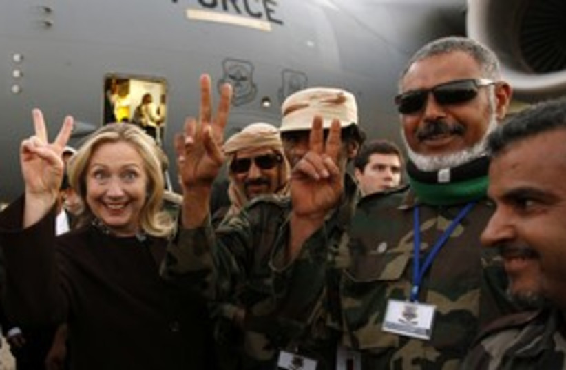 Clinton in Libya peace sign_311 (photo credit: Reuters)
