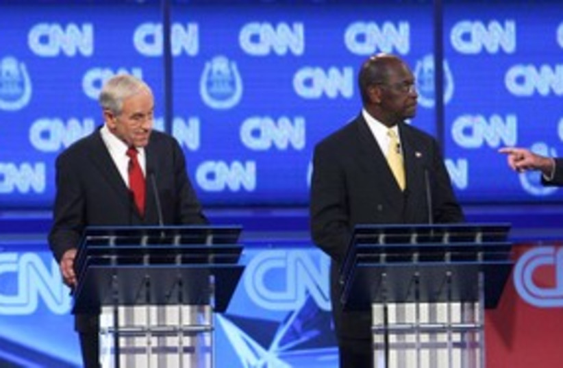 Republicans Ron Paul and Herman Cain 311 (R) (photo credit: REUTERS/Steve Marcus)