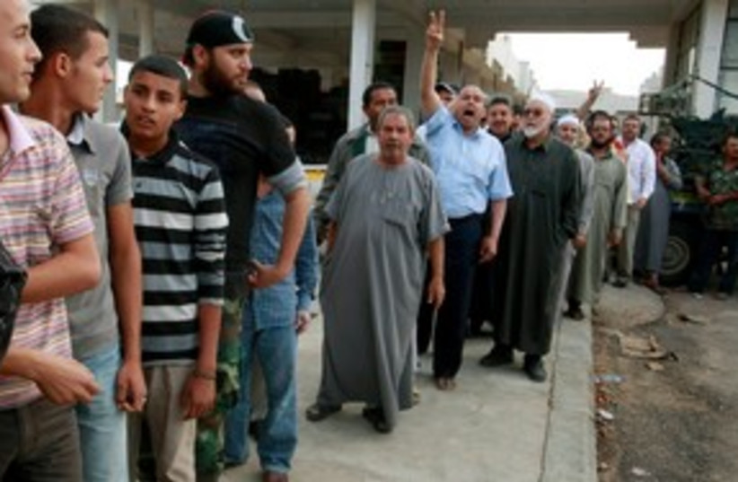 Libyans line up to see Gaddafi 311 (photo credit: REUTERS)