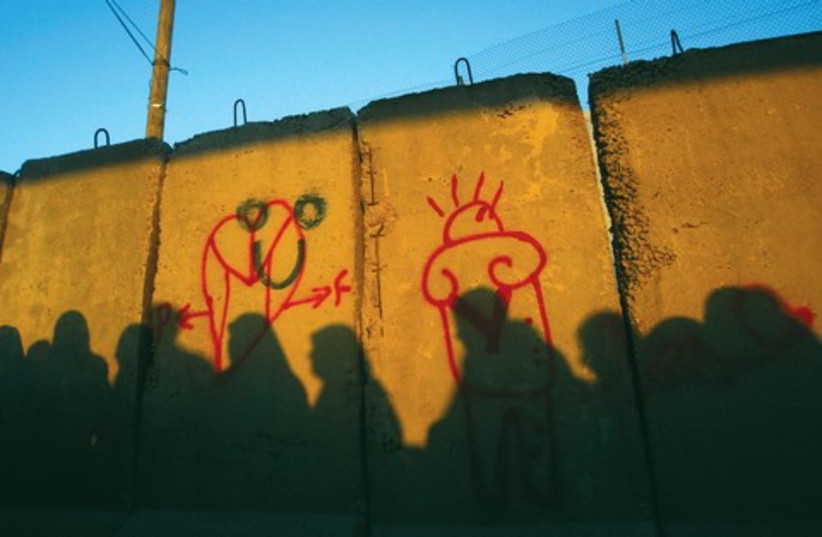 Palestinian women outside wall 521 (photo credit: REUTERS/Mohamad Torokman)