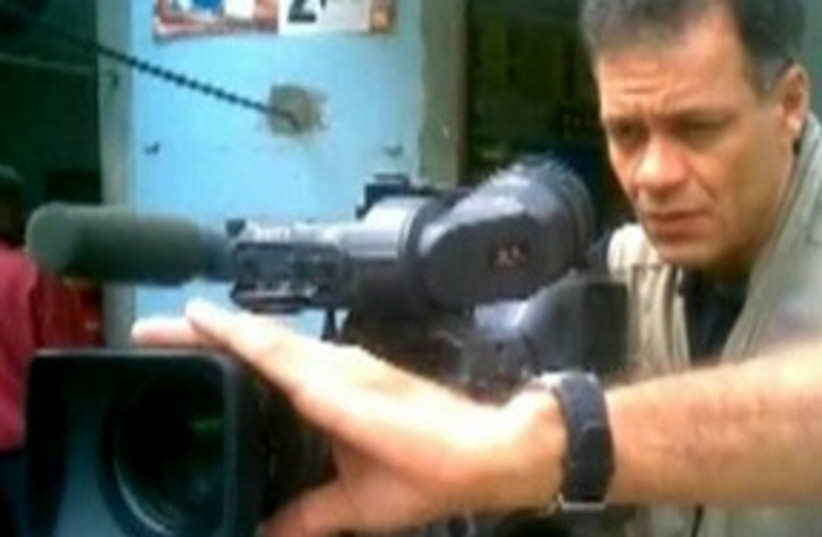 cameraman favela_311 (photo credit: REUTERS)