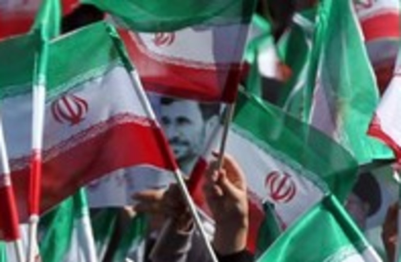 Iran flags ahmadinejad 300 (photo credit: REUTERS)