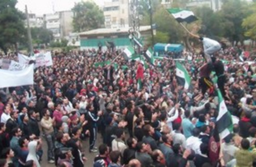 Demonstrators protest against Syria's President  Assad 311 R (photo credit: Reuters)