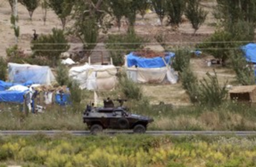 Turkish troops patrol border with Syria_311 (photo credit: Reuters/Osman Orsal)