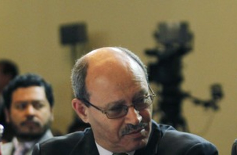 Palestinian Minister of National Economy Abu Libdeh (R) 311 (photo credit: REUTERS/Enrique Marcarian)