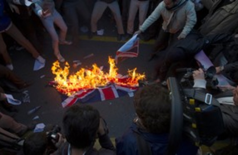 Iranians burn British flag 311 (photo credit: Reuters)